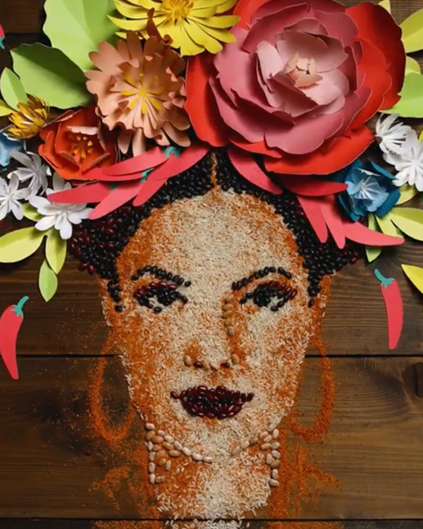 Custom DLV woman made from rice, beans, and paper flowers