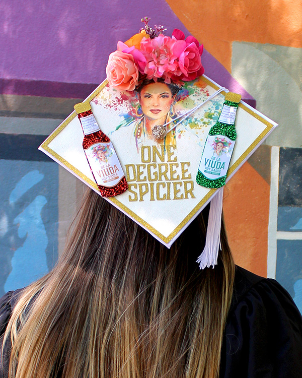 graduation cap designed with De La Viuda branding and text 