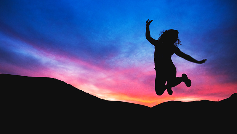 Woman jumping in celebration