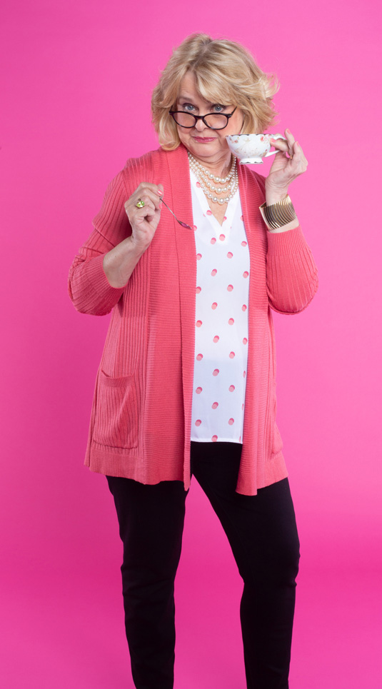 Judgy smother-in-law holding a cup of tea